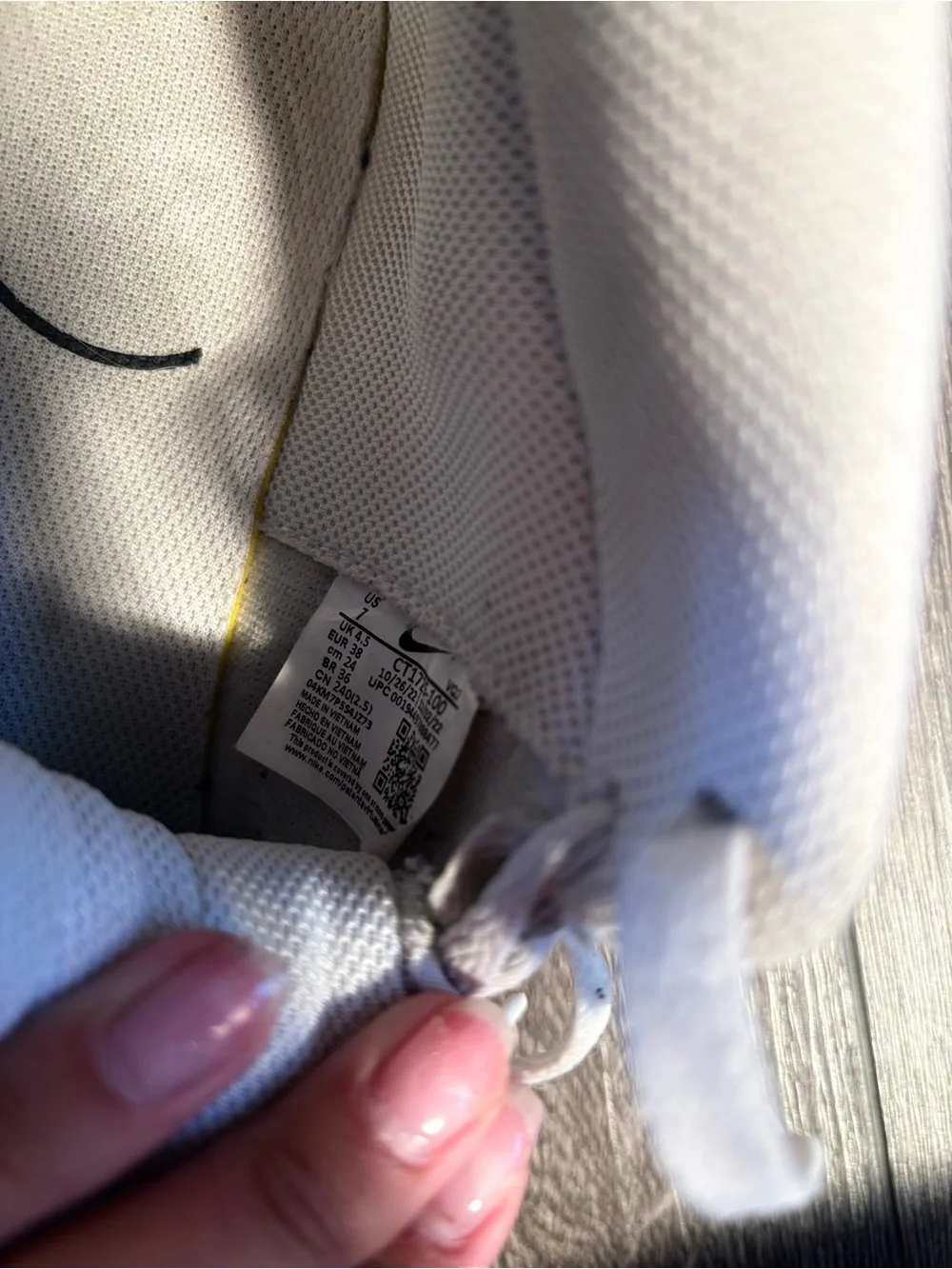 Nike White High-Top Sneakers with Tan Logo Patch
